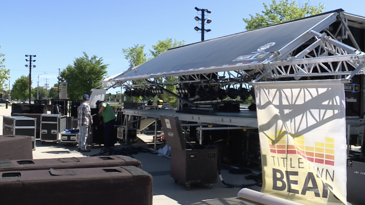Crews set up the stage for 'Titletown Beats' free summer concert series